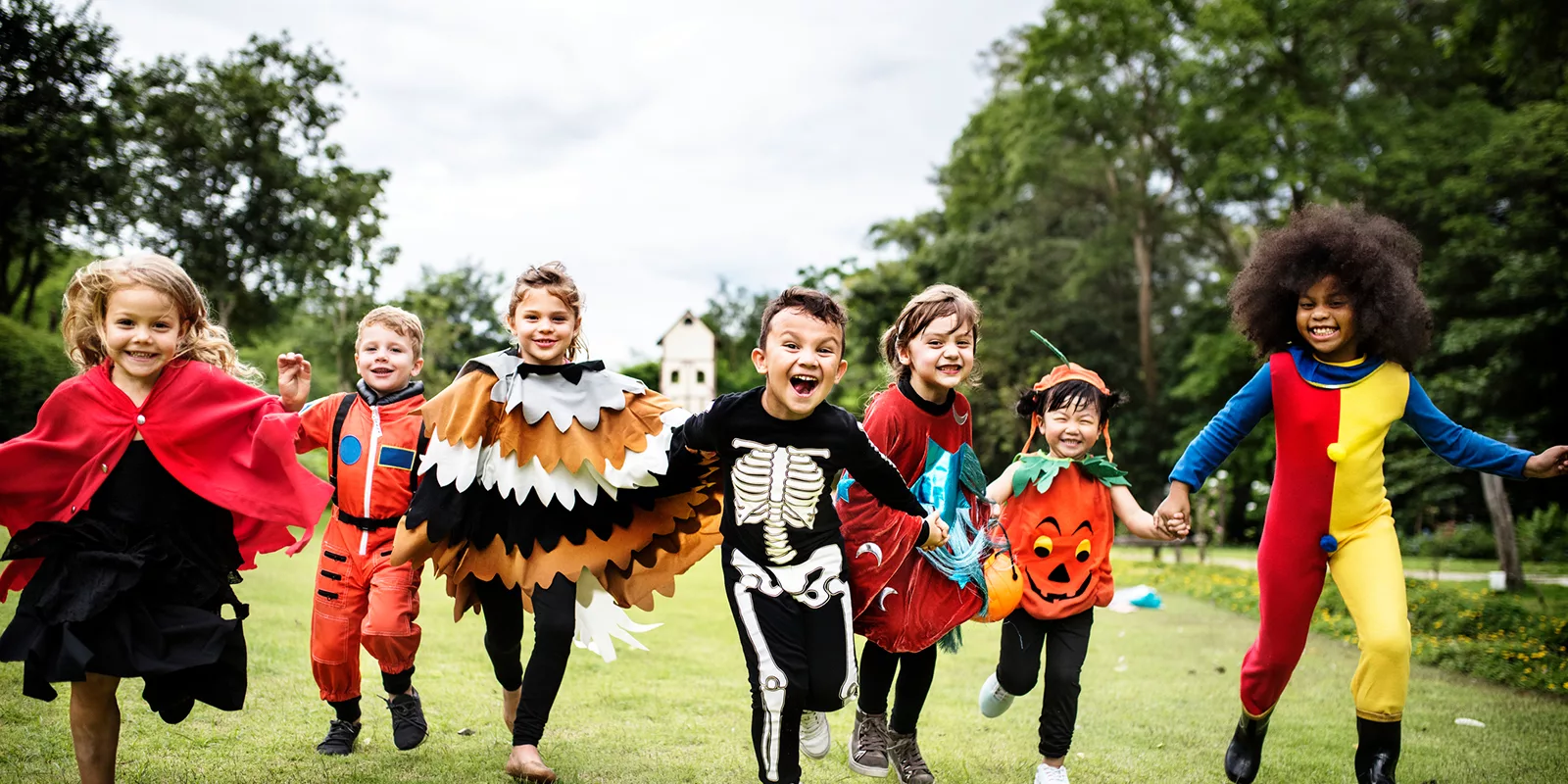 kids in halloween costumes running