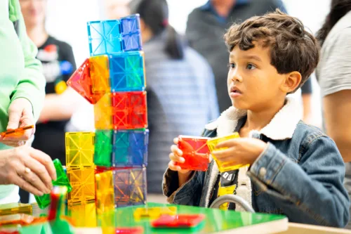 A child plays with a science, technology, engineering and math toy.