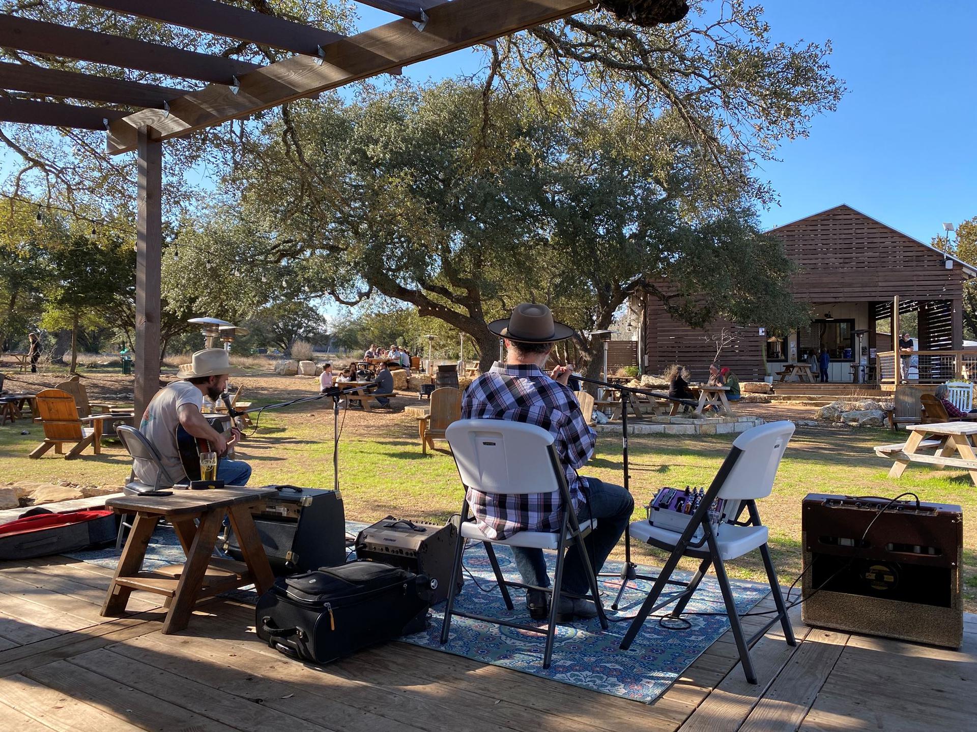 A band sits outdoors playing music