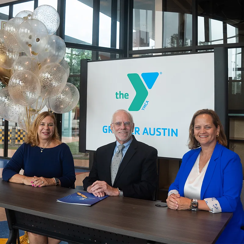 Jim & Coleen Clark of the Schmetterling Foundation with Greater Austin YMCA President & CEO Kathy Kuras