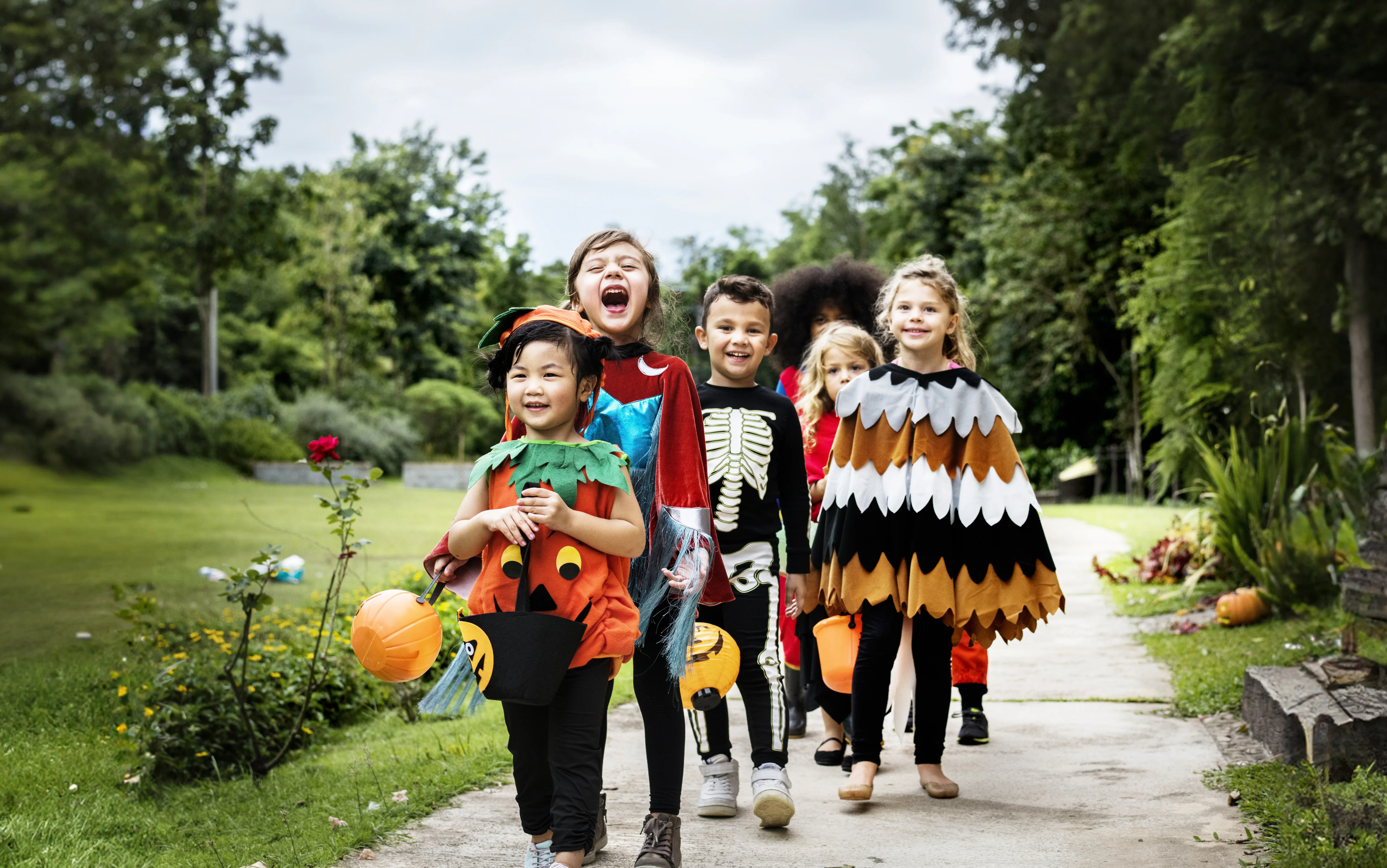 Young kids trick or treating during Halloween