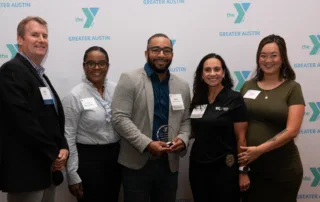 Best Buy Foundation representatives pose with Teen Tech Center Director and Greater Austin Y Associate Vice President