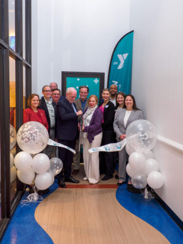 Greater Austin YMCA leadership and community partners cut the ribbon at Tomorrow Academy.