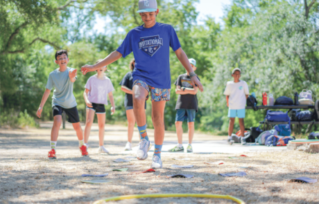 A group of campers at Camp Moody participate in a lively teambuilding game.